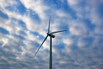 wind turbine in morning mist
