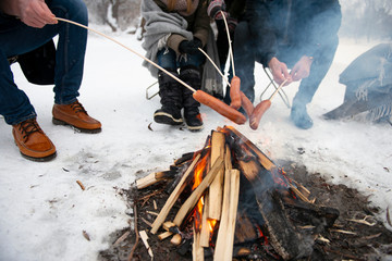 Friends having barbecue on a snowy day