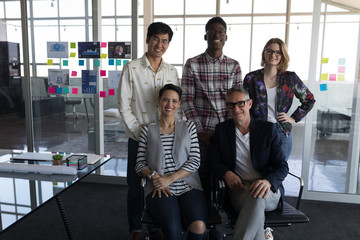 Business people posing together in office