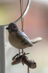 Vintage wooden bird hang on the air.