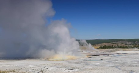Yellowstone National Park geyser basin steam. Geothermal ecosystem environment. Largest super volcano on the continent. Biology geography and ecology. Millions of tourist.