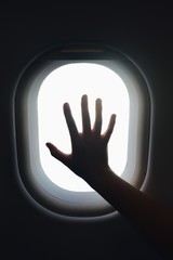 hand in airplane window