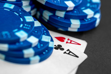 Poker chips and card on table