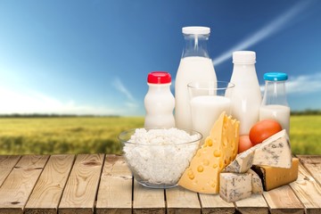 Glass of milk and bottle on  background