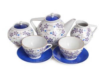 Antique porcelain tableware for tea on a white background