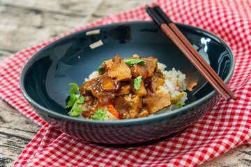 Asian style caramel pork with rice and vegetable