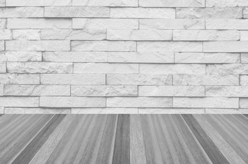 white brick wall and wooden floor