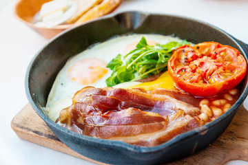 classical english breakfast with egg and ham