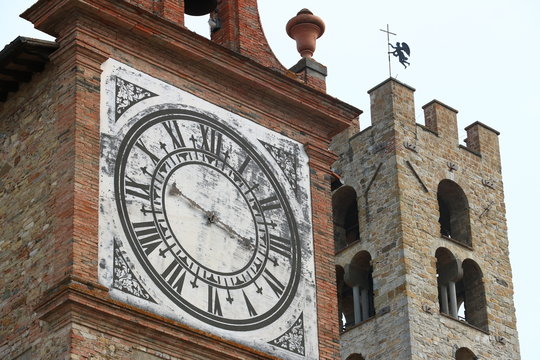 Towers with bell tower and large clock at the church of Imprunet