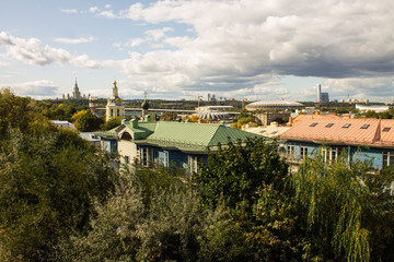 panoramic view on top of the roof of the building in the foreground and sights in the distance on...