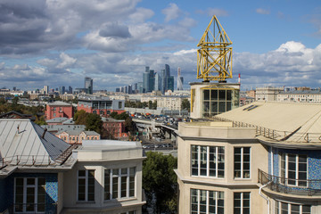 panoramic view on top of the roof of the building in the foreground and sights in the distance on...
