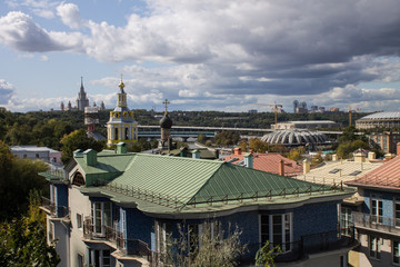 panoramic view on top of the roof of the building in the foreground and sights in the distance on...