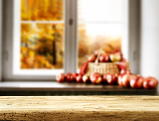 Desk of free space and autumn blurred background 