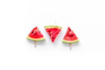 Popsicle from fresh watermelon on white background top view