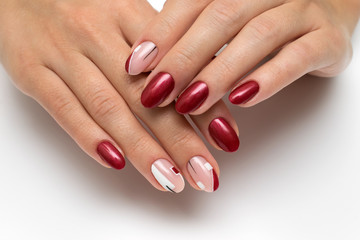 Stylish summer burgundy manicure with white and black abstraction, rectangles on long oval nails on...