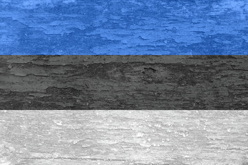 Estonia flag on an old painted wooden surface.