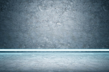 Empty room interior with grey wall and concrete floor separated by a long luminous lamp.