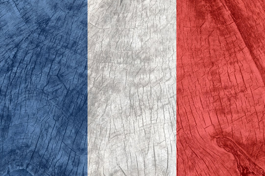 France flag on an old wooden surface.