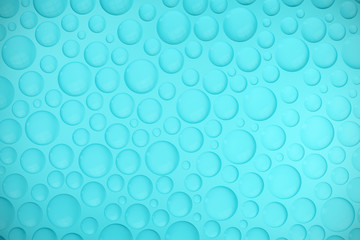Abstract water bubbles at blue background.