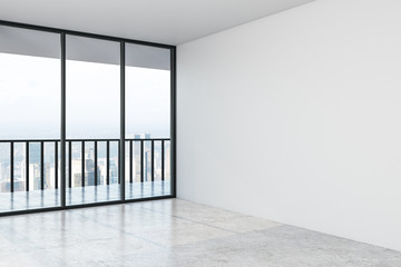 Empty modern hall with concrete floor, mock up wall and big window with city view in the afternoon.