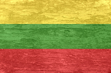 Lithuania flag on an old painted wooden surface.