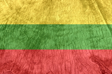 Lithuania flag on an old wooden surface.