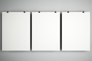 Blank white mock up minimalistic cardboard notebooks with stationery clips at light background.