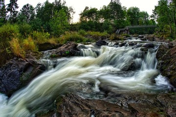 Water flowinf fast in river and rapids