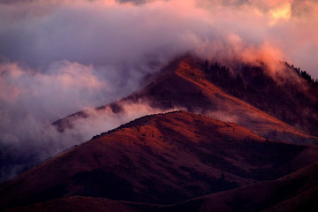 Mountain Wilderness with Clouds and Sunset Light