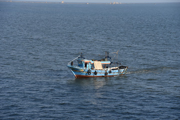 Fishing boat at sea near the Port Said, Egypt.