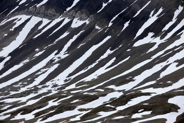 Snow parches on barren Arctic mountain