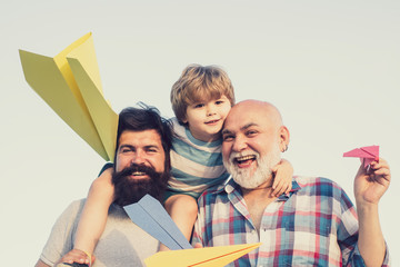 Generation. Father and son with grandfather - happy loving family.