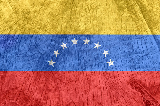 Venezuela flag on an old wooden surface.