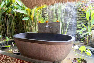 Romantic outdoor stone bathroom in island Bali, Indonesia