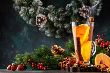 Christmas or New Year hot winter drink, spicy grog cocktail, sangria or mulled wine with tea,...