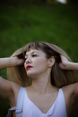 Fototapeta premium portrait of young woman in the park