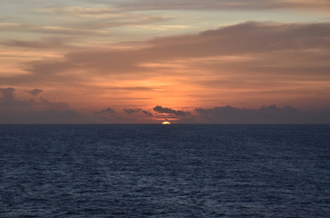 Fototapeta premium Sunset over the sea, view from the sailing ship.