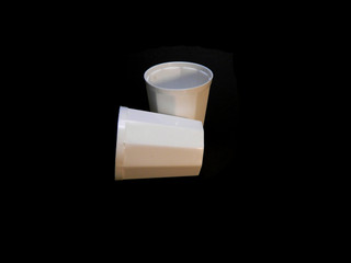 plastic cup isolated on black background