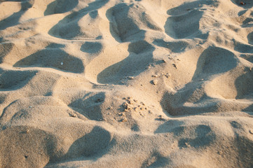 Sand texture of golden color. Beautiful sandy background.