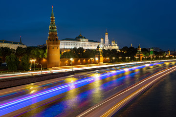 Fototapeta premium Russia. Moscow. The concept is speed in Moscow. Highway. Long exposure. Kremlin in Moscow. Highways in Russia. Grand Kremlin Palace at night. Blagoveshchensky cathedral. Trips around Russia.