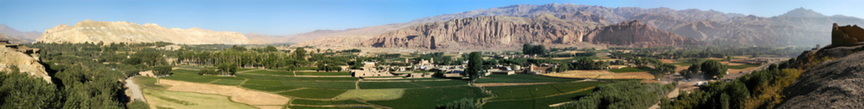 Very large panorama (49MP) of Bamyan (Bamiyan) in Central Afghanistan. This is a view over the Bamyan (Bamiyan) Valley showing both Buddha niches in the cliff. UNESCO site: Afghanistan Buddhas.