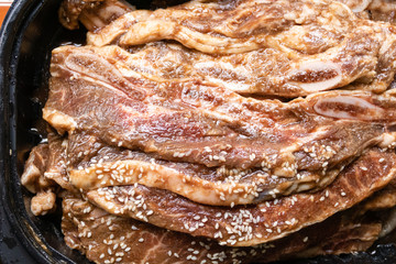 Bowl of raw beef rib steaks