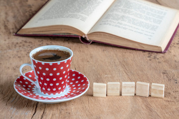 Book and coffee cup on table with copy space