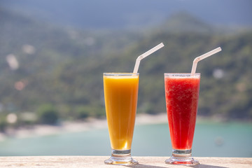 Two fresh organic shake from mango and watermelon in thai restaurant on the beach near sea in Thailand. Close up