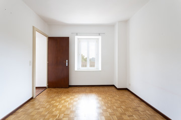 Fototapeta premium Empty room with white walls and window overlooking nature