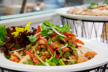  spicy salmon Thai salad on white plate