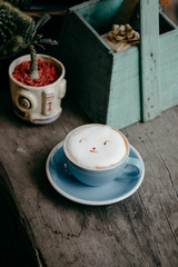 cup of coffee on wooden table