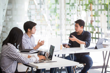 Asian student groups work together to research, work on classroom education