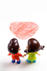 Two cartoon dolls on drawing paper