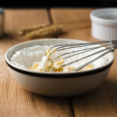 Close-up view of whisk in a bowl